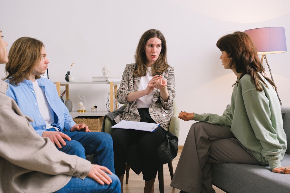 Psychotherapist giving advice to a group of patients