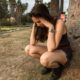 Young woman experiencing emotional distress in nature