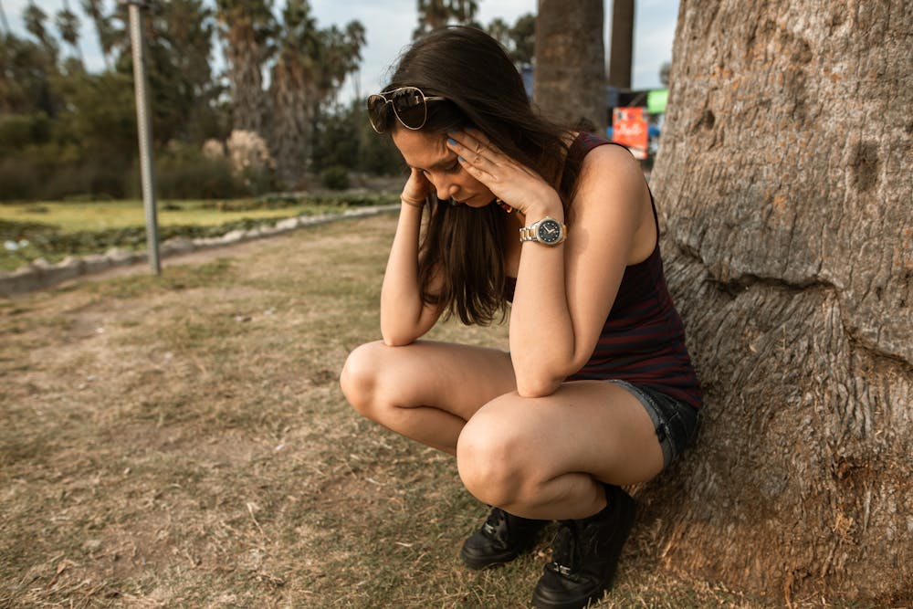 Young woman experiencing emotional distress in nature